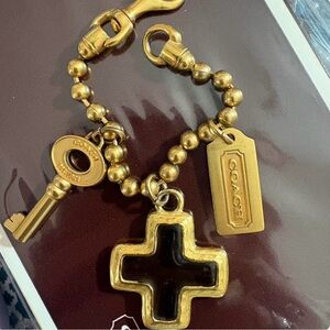 Coach Gold Charm Bracelet with Cross, Hangtag, and Key